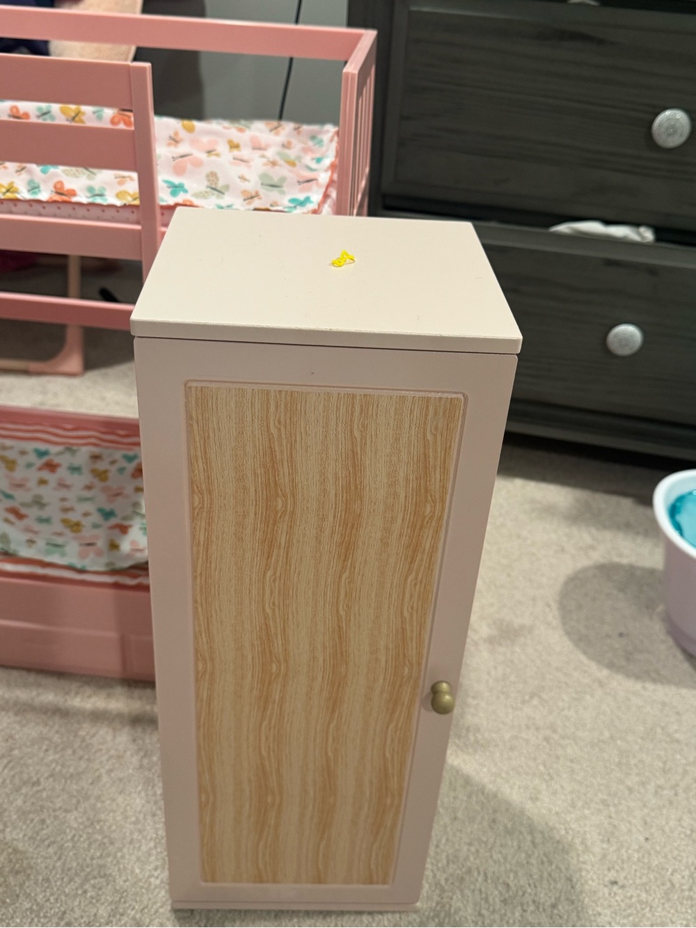 Pink Storage Cabinet with Wood-Grain Door - Compact Organizer